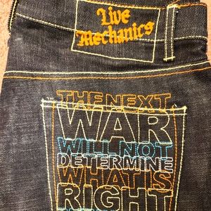 Live Mechanics Sz 34 denim jeans with "Peace in our time" embroidered in pocket